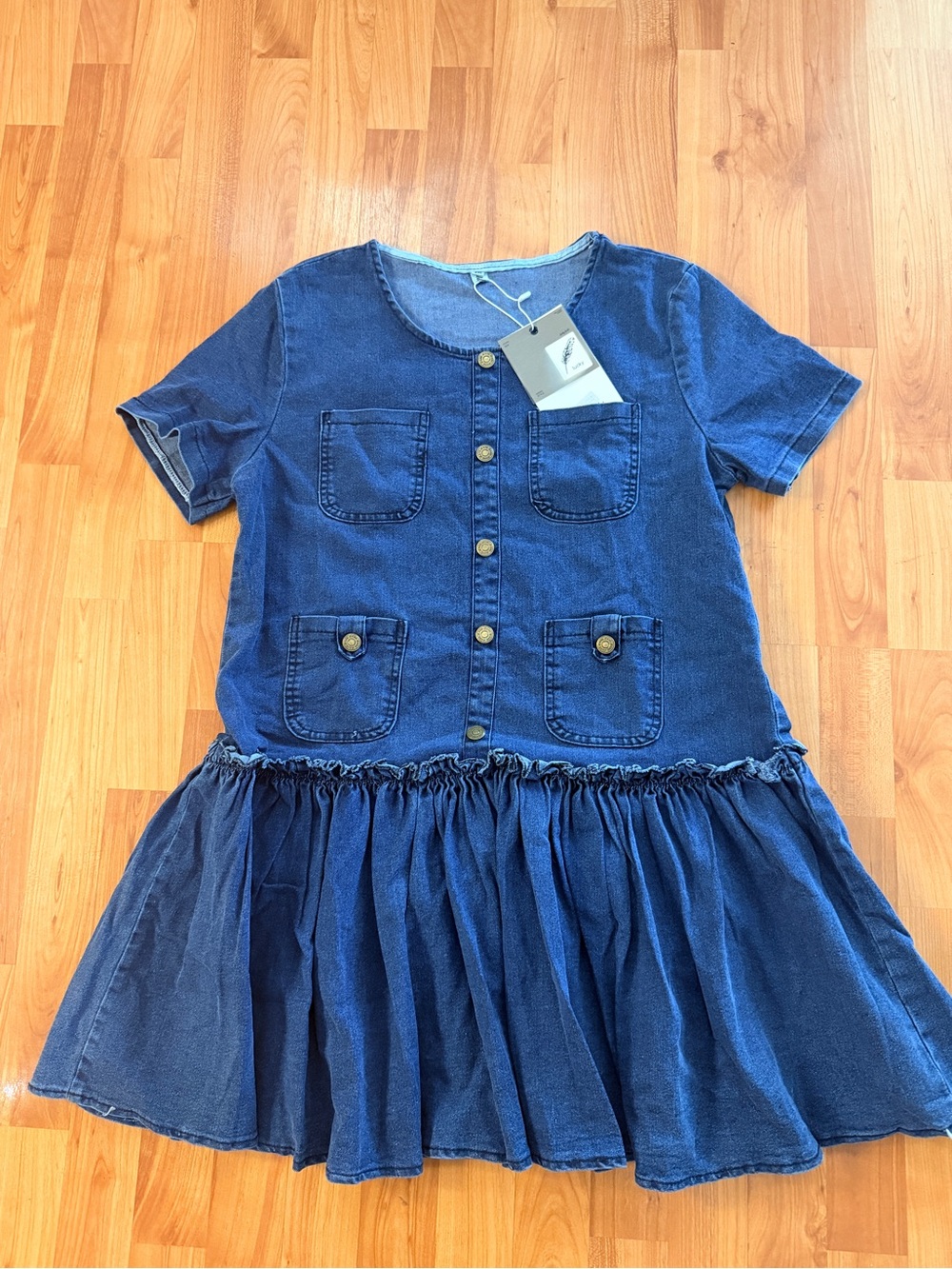 Denim doll dress with pockets. New with Tag.
Pit to Pit- 42 
Hips - 43